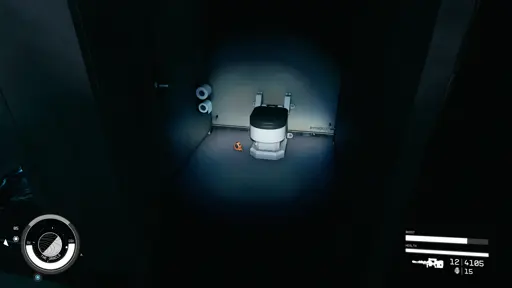 Screenshot from Starfield, showing a bathroom cubical, with a measuring tape on the floor next to the toilet